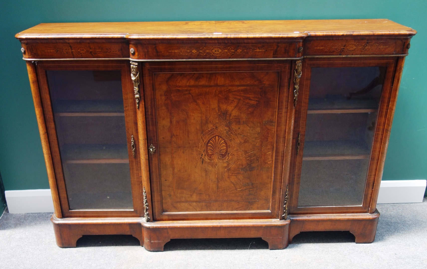 Appraisal: A Victorian inlaid figured walnut breakfront credenza with panel central