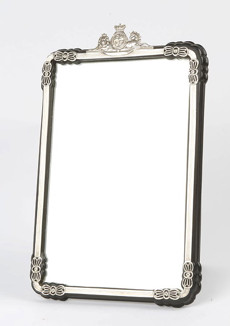 Appraisal: A COLONIAL EBONISED AND SILVER MOUNTED DRESSING MIRROR with Royal