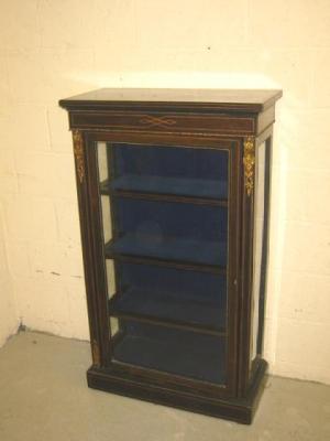 Appraisal: A VICTORIAN EBONISED PIER DISPLAY CABINET of oblong form with