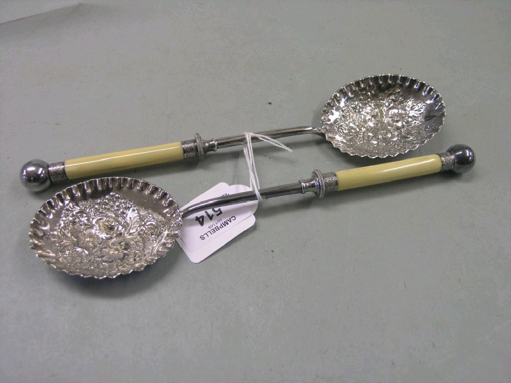 Appraisal: A pair of late Victorian silver plated salad servers the