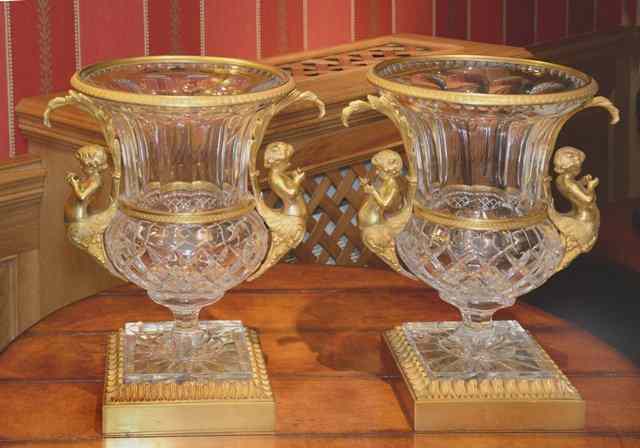 Appraisal: A PAIR OF ORMOLU MOUNTED CUT GLASS CAMPAGNA URNS the