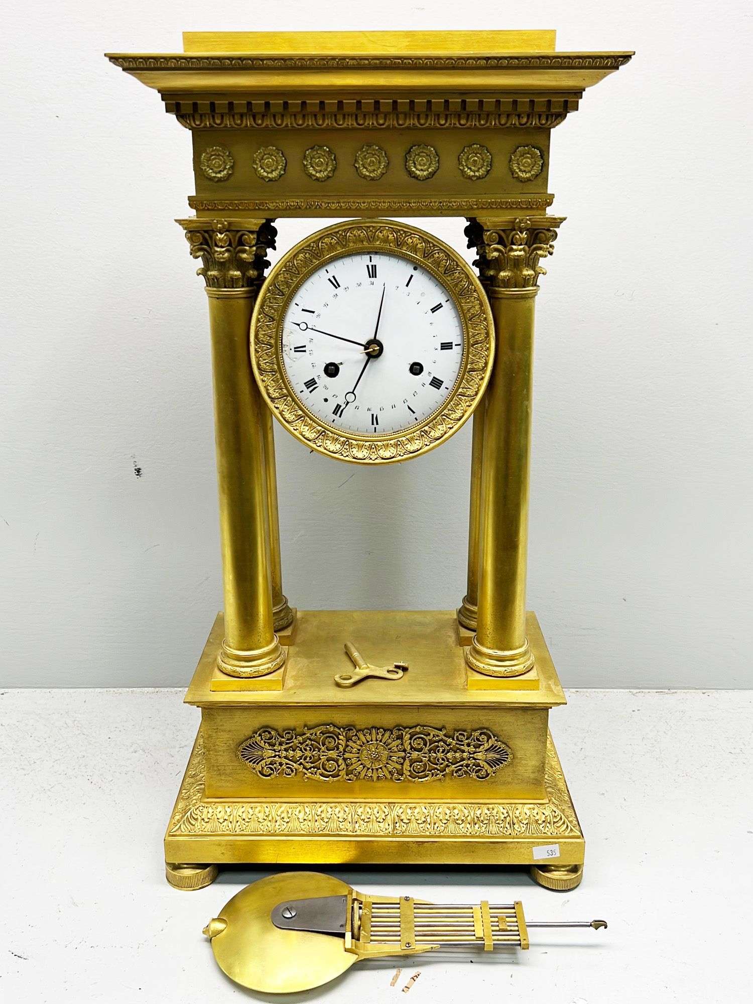 Appraisal: French dore bronze portico clock time thC TIme strike w