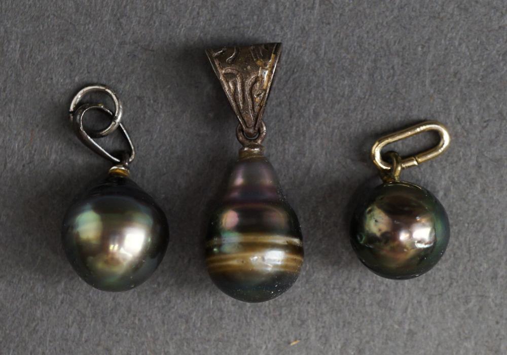 Appraisal: THREE BAROQUE TAHITIAN PEARL PENDANTSThree Baroque Tahitian Pearl Pendants Largest