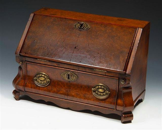 Appraisal: A DUTCH FIGURED WALNUT MINIATURE BUREAU with stepped interior enclosed