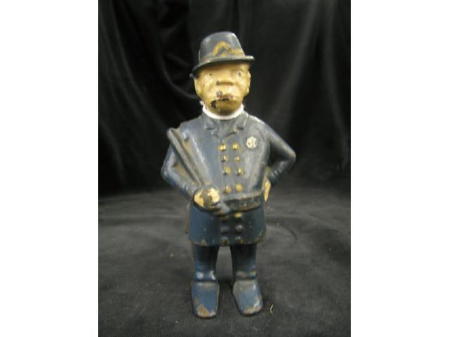 Appraisal: Victorian Cast Iron Figural Still Bank of a Keystone Cop