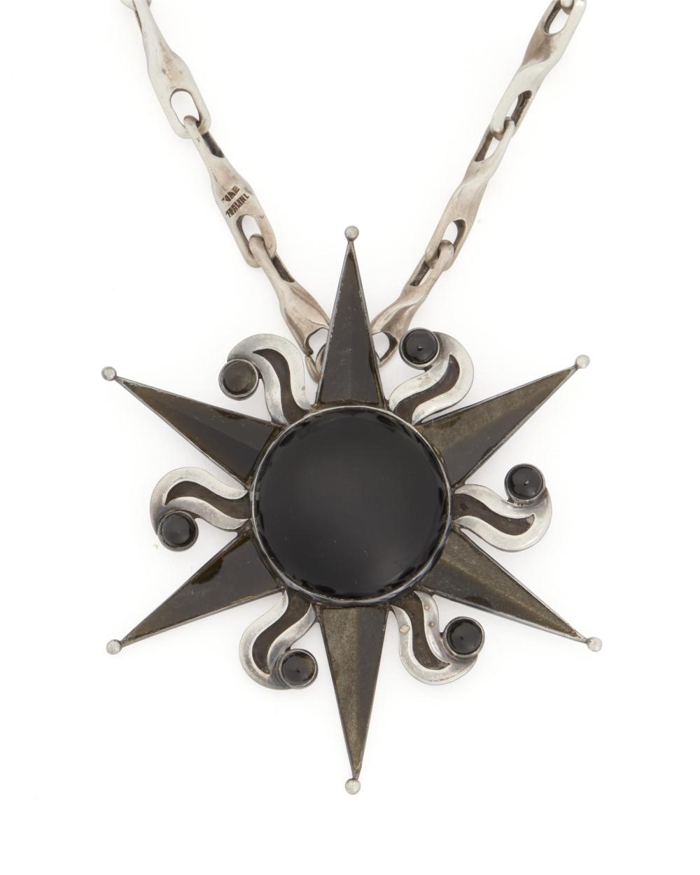 Appraisal: An Antonio Pineda silver onyx and obsidian pendant brooch with