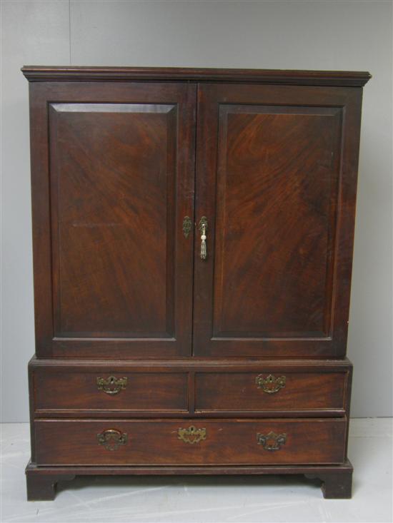 Appraisal: George III mahogany linen press with two panelled doors the