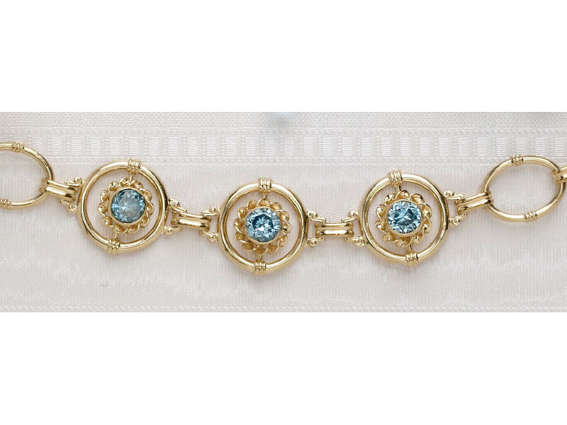 Appraisal: BLUE ZIRCON BRACELET k yellow gold open design link bracelet