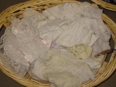 Appraisal: A basket of dolls underclothes in white and cream some