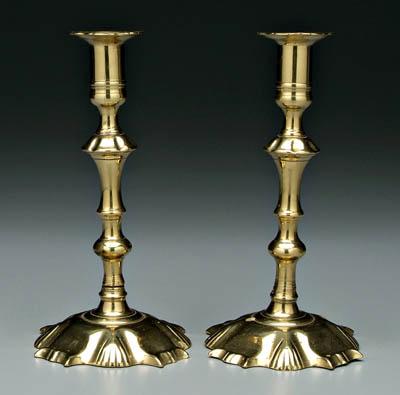 Appraisal: Pair petal base brass candlesticks scalloped socket rims above baluster