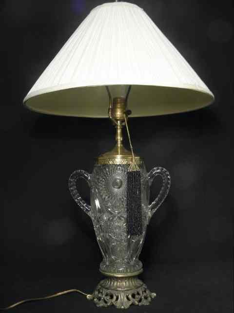 Appraisal: A pressed glass trophy vase mounted as a lamp with