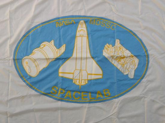 Appraisal: SpaceLab Flag A large blue and white flag illustrating a