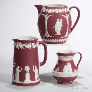 Appraisal: Three Wedgwood Crimson Jasper Dip Jugs England c each with