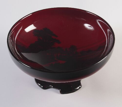 Appraisal: A Royal Doulton flamb footed bowl painted to the interior