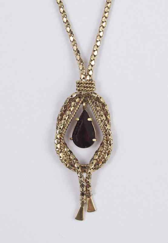 Appraisal: K NECKLACE WITH RED STONE K yellow gold necklace with