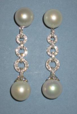 Appraisal: A PAIR OF CULTURED PEARL AND DIAMOND NIGHT AND DAY