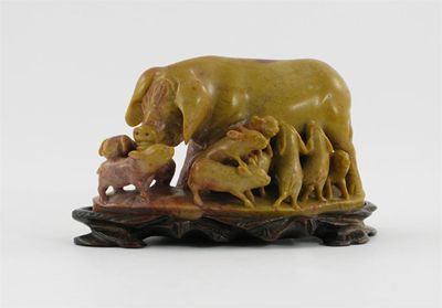 Appraisal: A Chinese steatite carving of a sow with nine piglets