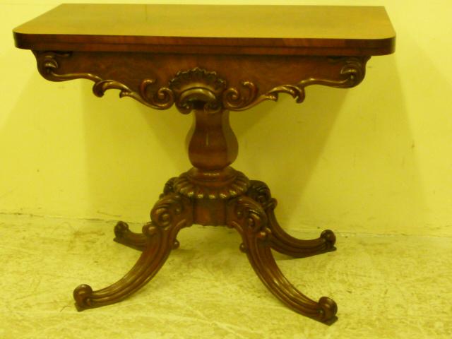 Appraisal: A VICTORIAN MAHOGANY FOLDING TEA TABLE of rounded oblong form