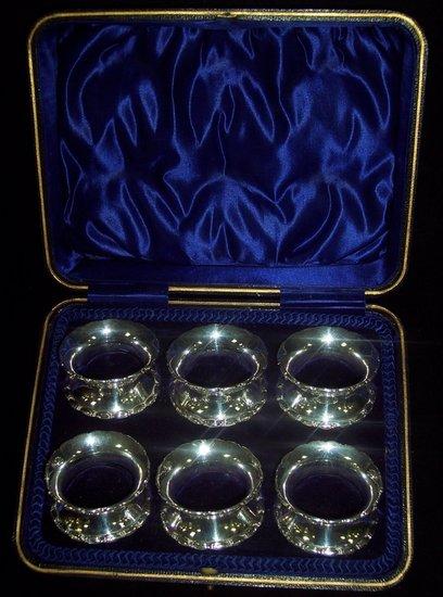 Appraisal: A cased set of six numbered napkin rings with beaded