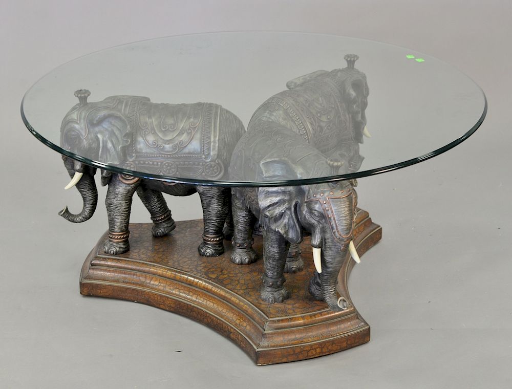 Appraisal: Coffee table with triple elephant base and glass top ht