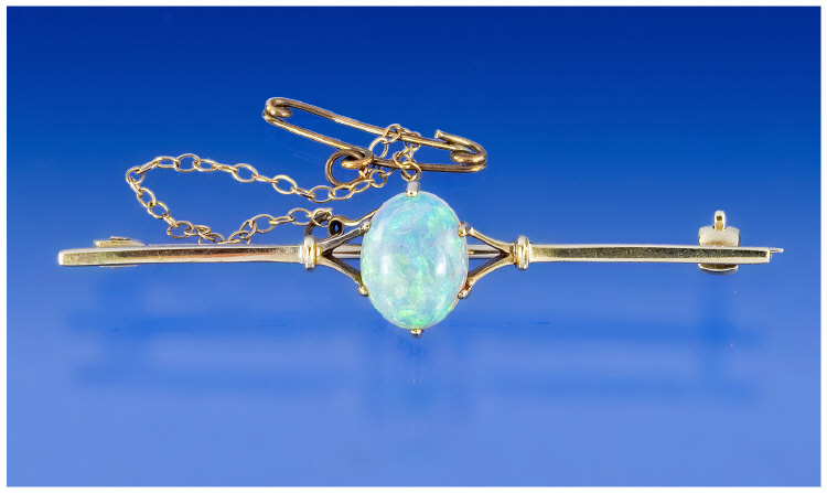 Appraisal: ct Gold Opal Bar Brooch Set With A Central Oval