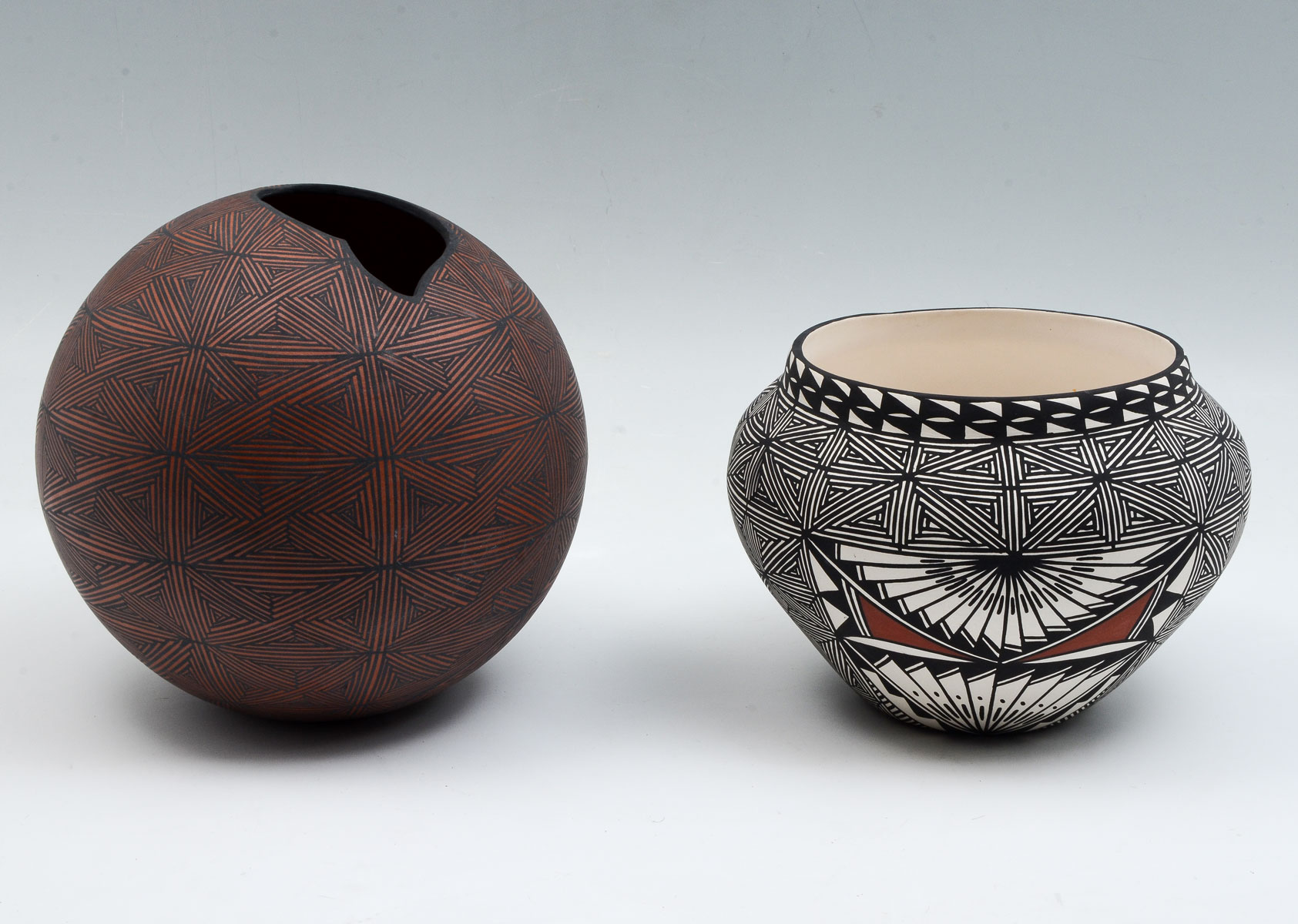 Appraisal: NATIVE AMERICAN ACOMA POTTERY JARS Organic rounded black orange geometrically