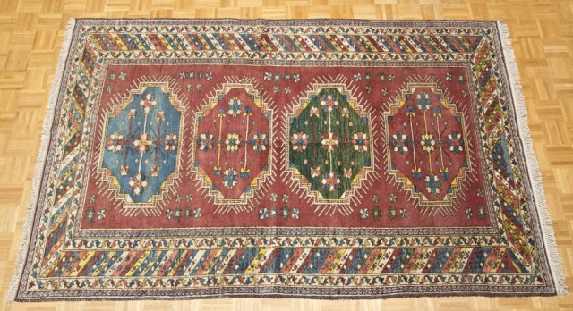 Appraisal: Semi-Antique Tribal Carpet Red field with blue and green center