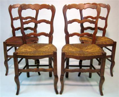 Appraisal: Four French provincial oak rattan upholstered side chairs th century