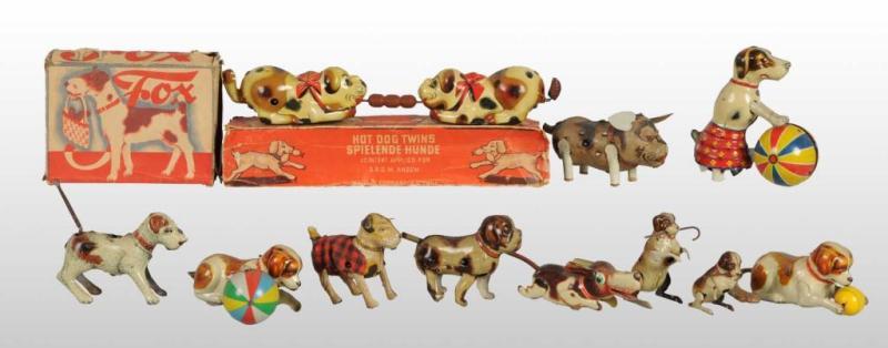 Appraisal: Lot of Tin Dog Wind-Up Toys Description Some are made