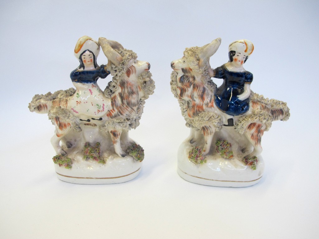 Appraisal: Pair of Staffordshire figures of a couple each on a