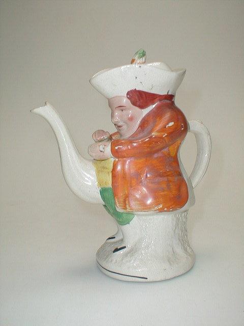 Appraisal: A Victorian Staffordshire Toby Teapot of The Squire taking snuff