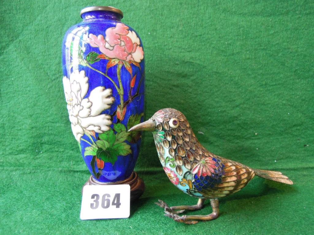 Appraisal: A cloisonne bird with floral body and feather wings and