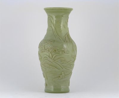 Appraisal: A Chinese Beijing celadon coloured glass vase carved with a