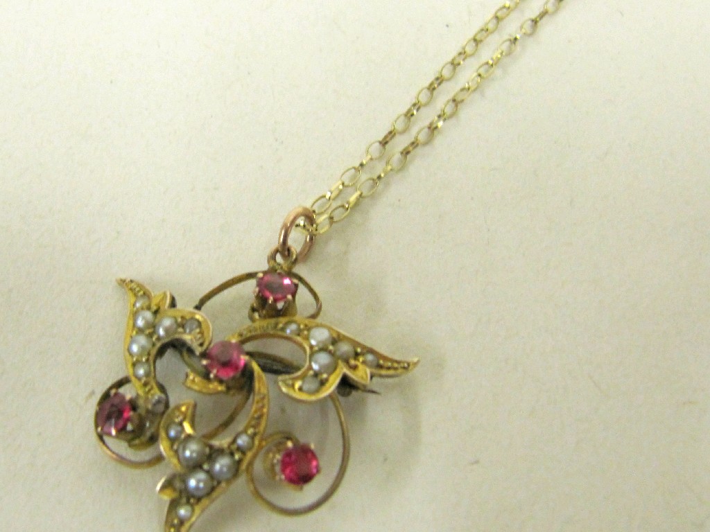 Appraisal: Edwardian yellow metal pendant set with pink tourmaline and seed