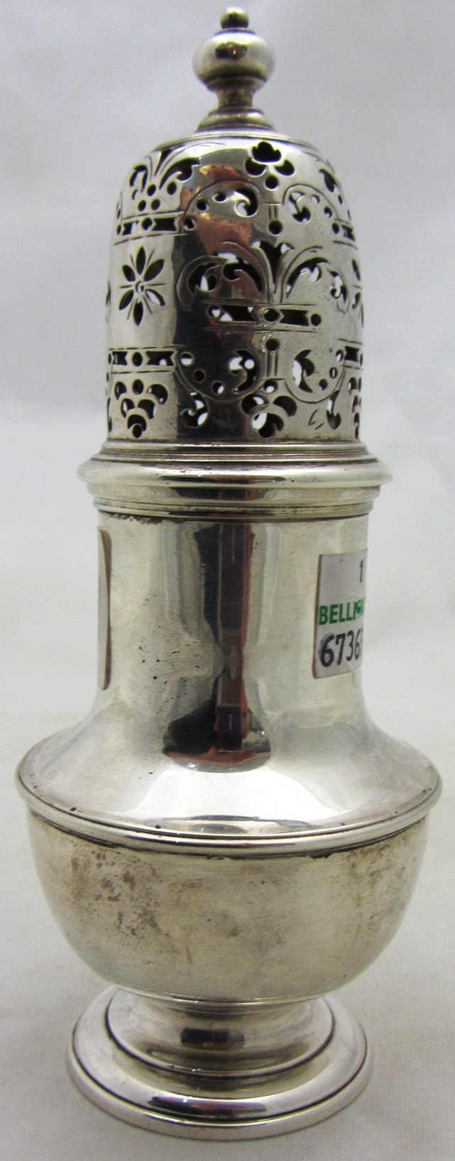 Appraisal: A George II silver sugar caster of baluster form on