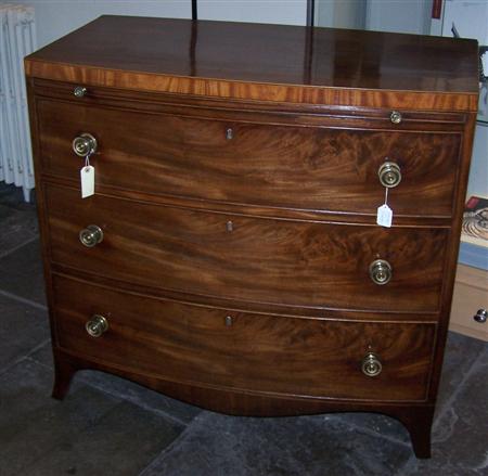 Appraisal: A Regency mahogany bowfront dressing chest the satinwood banded frieze