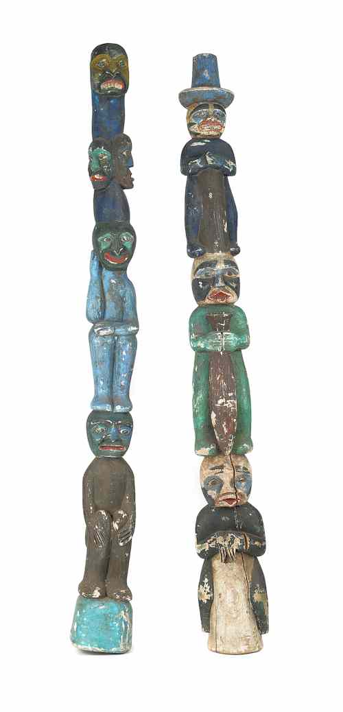 Appraisal: Pair of carved and painted totem poles h Provenance Pennsylvania