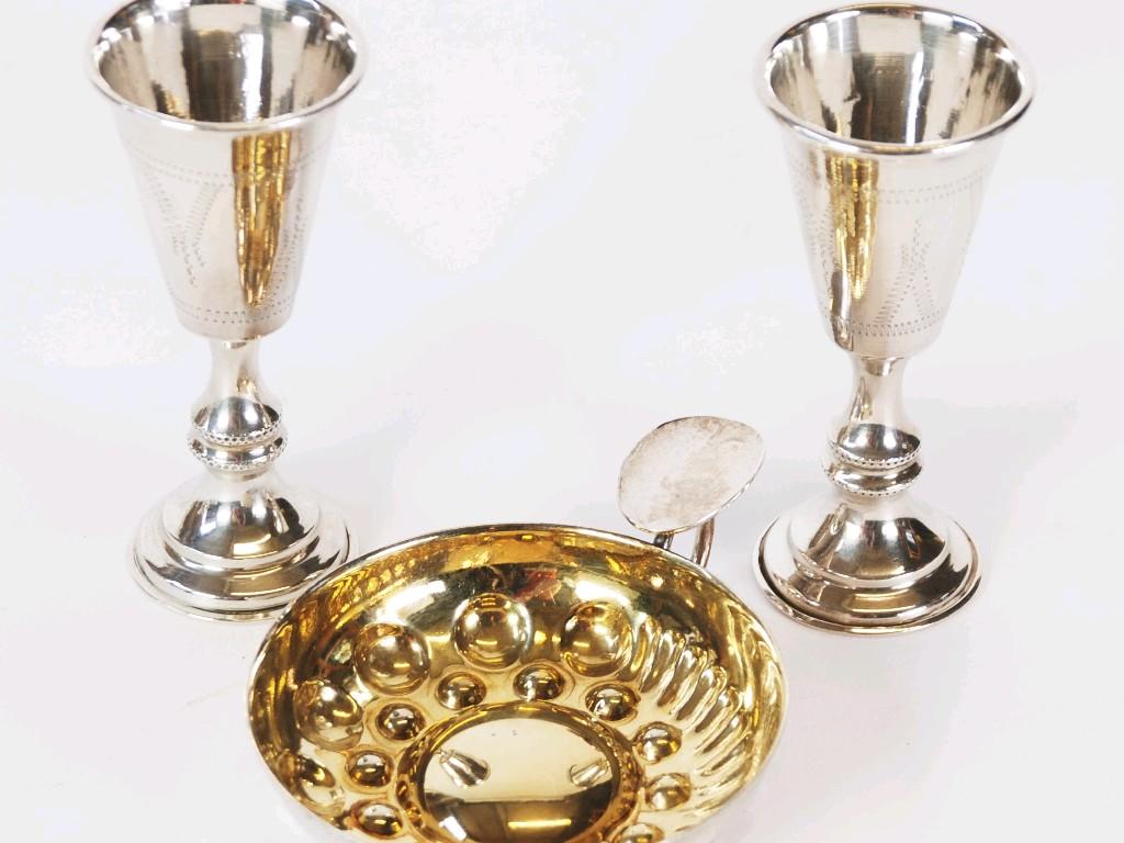 Appraisal: PAIR OF GEORGE V ENGRAVED SILVER CEREMONIAL WINE GOBLETS the