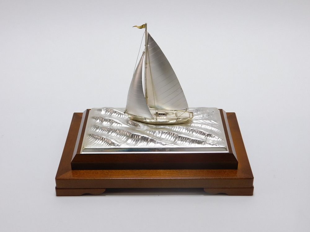 Appraisal: Takehiko Seki Silver Sailboat Sculpture Japanese th Century Depicts a