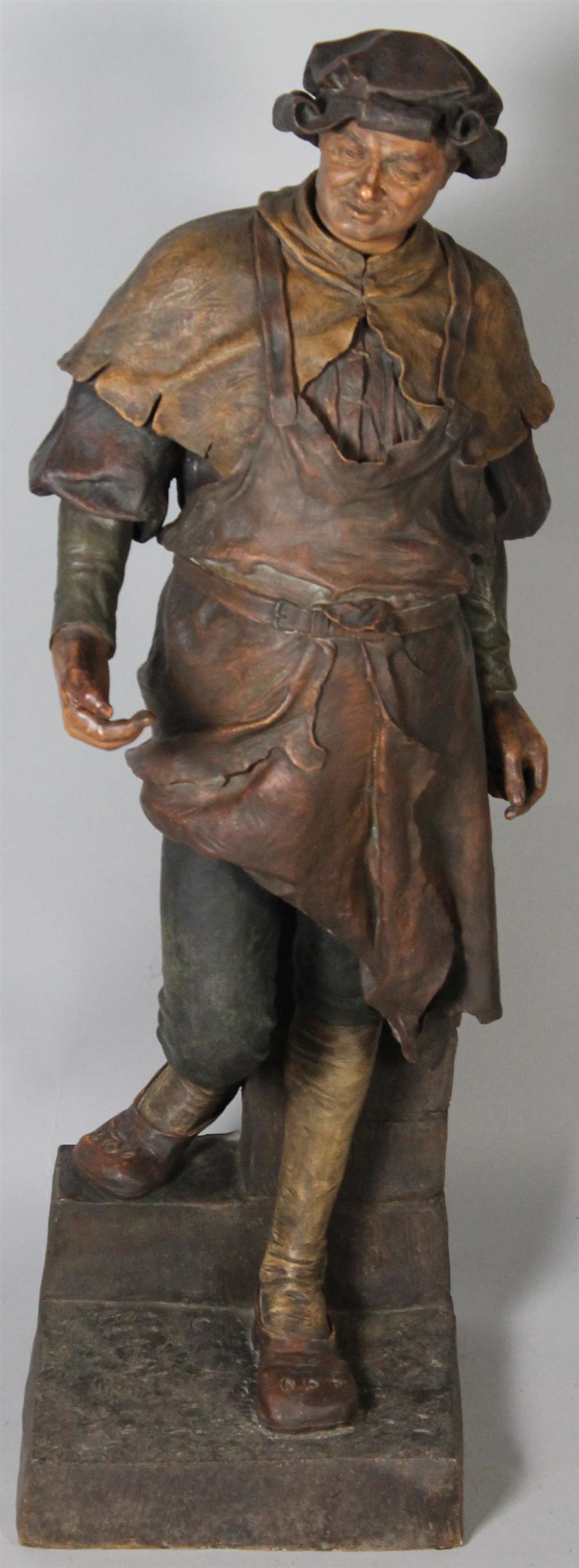 Appraisal: GLAZED TERRACOTTA STATUE OF A MAN the statue of a