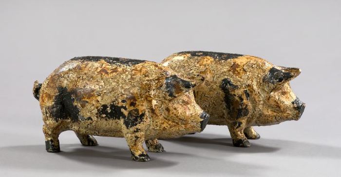 Appraisal: Pair of English Black- and White-Painted Cast-Iron Piglets the painted