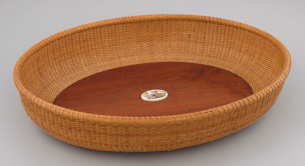 Appraisal: LARGE NANTUCKET BASKET Dated Shallow oval Oval polychrome medallion at