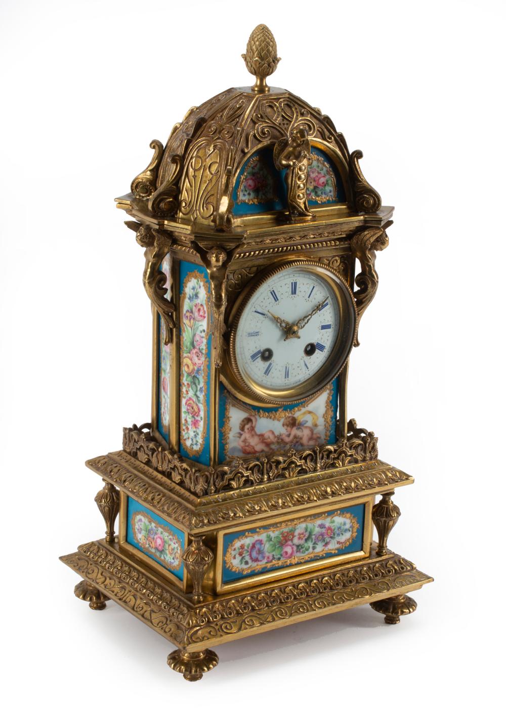 Appraisal: French Renaissance-Style Bronze and Porcelain Mantel Clock dial marked Raingo