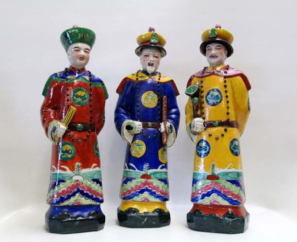 Appraisal: THREE CHINESE PORCELAIN GLAZED STANDING MALE FIGURES each finely glazed