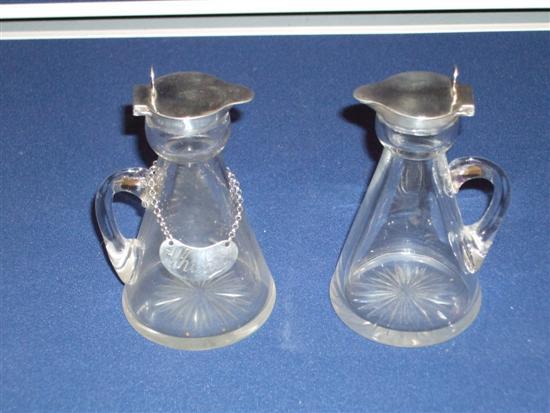 Appraisal: Pair of glass and silver mounted whisky noggins with star