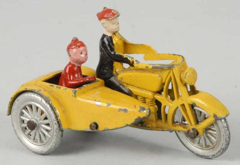 Appraisal: Diecast Tootsietoy Smitty Motorcycle Toy Description With sidecar and articulated