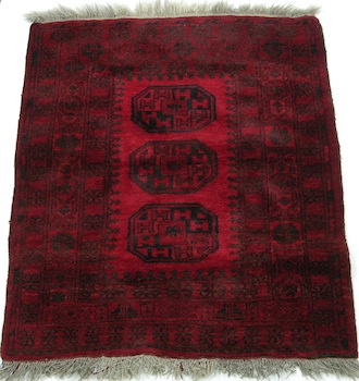 Appraisal: A Square Turkomen Carpet Three central medallions in black wool