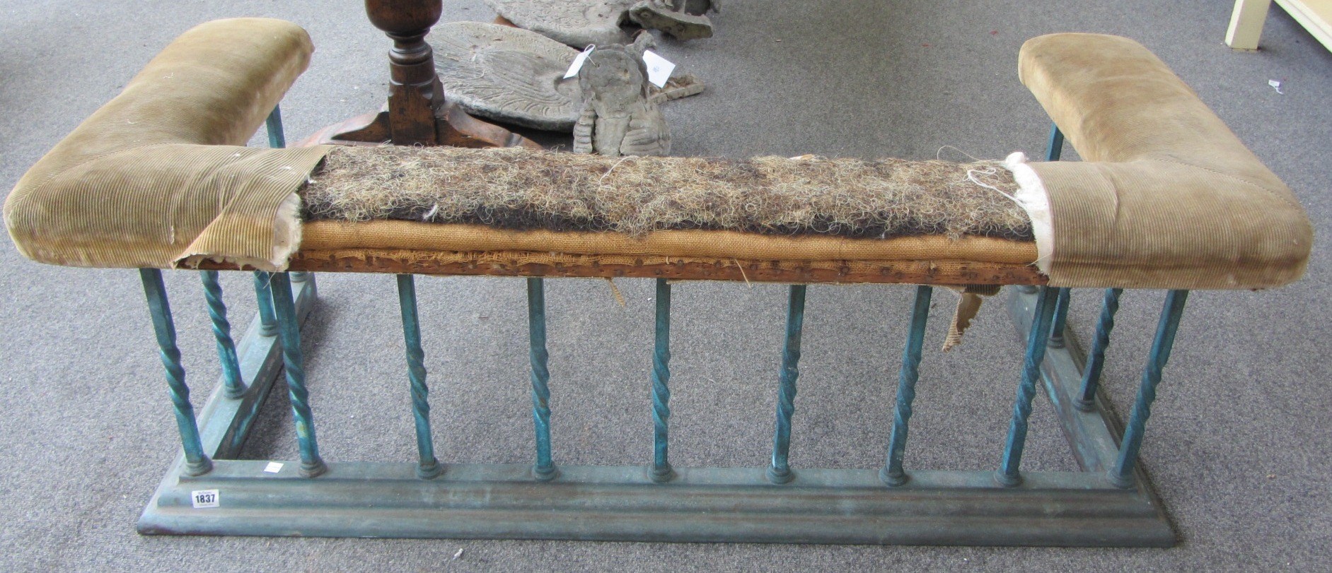 Appraisal: A th century brass club fender with overstuffed top rail