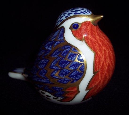 Appraisal: A Royal Crown Derby paperweight a robin date code LIII