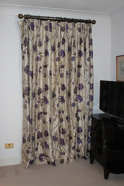 Appraisal: A PAIR OF CREAM GROUND SILK INTERLINED CURTAINS with stitched